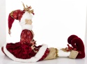 Elf sitting in a burgundy coat (178866)
