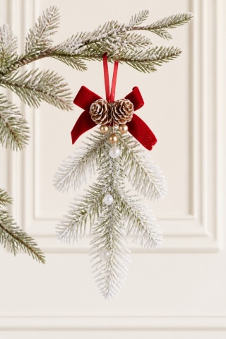 Snow-dusted Christmas tree branch hanging decoration with bow and pine cones (554080)(A)